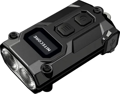 A black Nitecore TINI 3 LED keychain flashlight is shown from a slightly elevated angle against a white background.