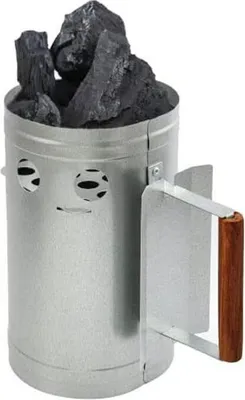 A charcoal chimney starter filled with charcoal briquettes, shown against a white background.