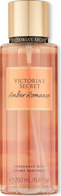 A product shot of a Victoria's Secret Amber Romance fragrance mist bottle.