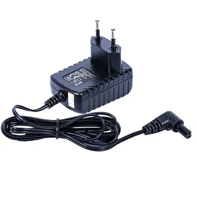 A black power adapter with a coiled cable and a right-angle connector.