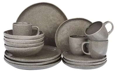 A set of stoneware dishes and cups arranged on a white background.