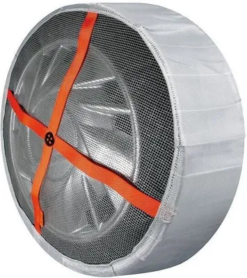 A close-up view of a tire with a textile snow sock installed.