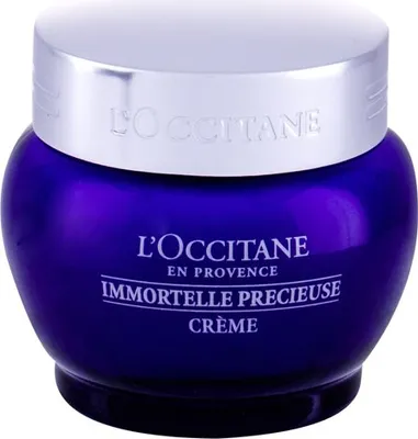 A close-up studio shot of a L'Occitane Immortelle Precious Cream jar.
