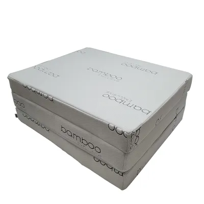 A folded mattress on a white background.