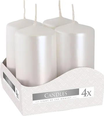 Four white pillar candles in a cardboard display box.