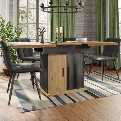 A dining table set in a dining room with chairs, a rug, and curtains.