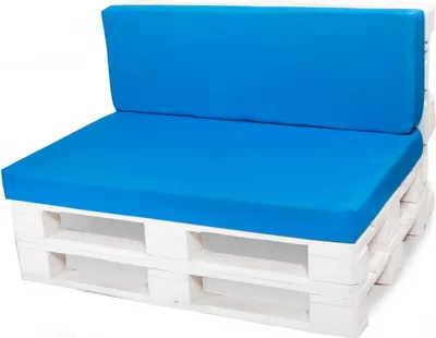 A white pallet sofa with blue cushions.