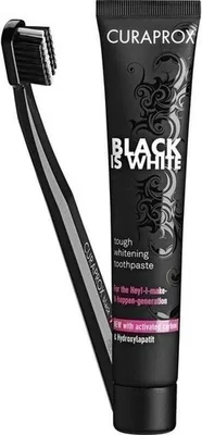 A black toothbrush and a black tube of toothpaste are displayed against a white background.
