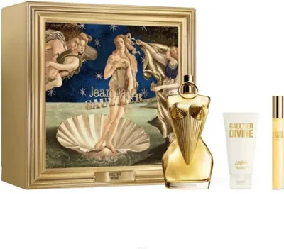 A Jean Paul Gaultier fragrance gift set featuring a perfume bottle, lotion, and a travel spray, presented in a box with artwork.