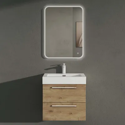 A bathroom vanity set with a sink and mirror against a gray wall.