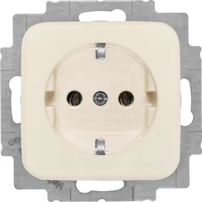A close-up studio shot of a cream-colored electrical outlet mounted on a metal frame.