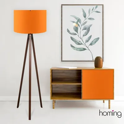 A modern living room scene featuring a floor lamp and a cabinet.