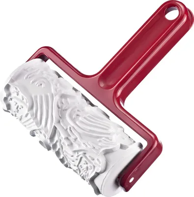 A red and white rolling pin with an embossed pattern.