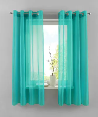 A window with turquoise curtains and sheer fabric.