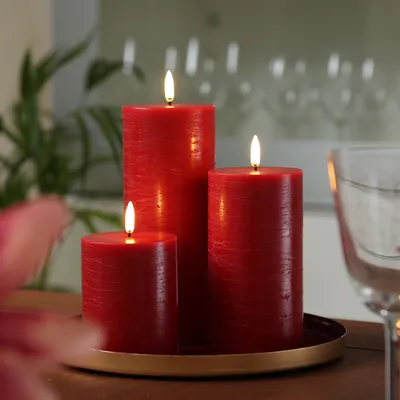 Produktbild von LED Kerzenset PIA - Rustik-Optik - 3 Größen - inkl. Batterien und Fernbedienung - rot - 3er Set