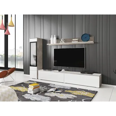A modern living room with a TV stand, entertainment center, and decorative items.