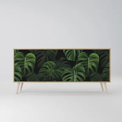 A sideboard with a monstera leaf pattern on a white background.