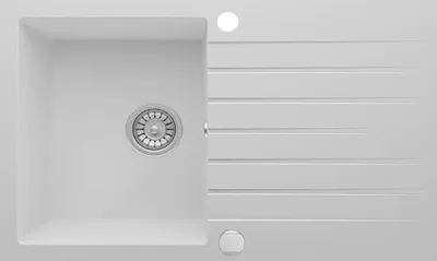 A top-down view of a white granite kitchen sink with a drain and a ribbed draining board.