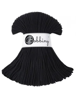A bundle of black cord is displayed against a white background, with a label around the middle.