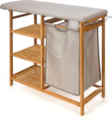 A bamboo ironing board with shelves and a laundry bag.