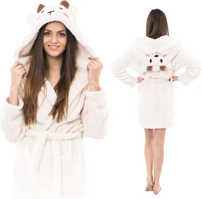 A woman wearing a white hooded bathrobe with bear-like features.