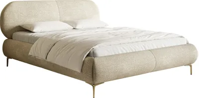 A studio shot of a beige upholstered bed with golden legs.