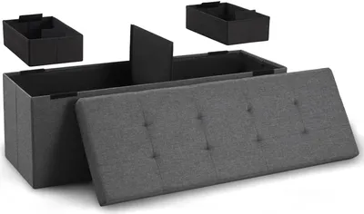 A storage ottoman with its lid open, showing internal dividers and two separate storage boxes. The ottoman is upholstered in gray fabric with button tufting on the lid.