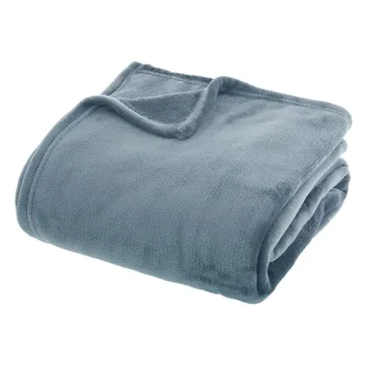 A folded blue blanket on a white background.