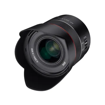 A black camera lens with a lens hood attached, shown against a white background.
