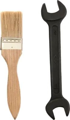 A paintbrush and a wrench are placed side-by-side on a white background.