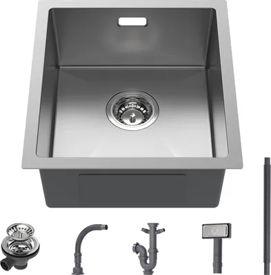 A stainless steel kitchen sink with various plumbing accessories displayed below it.