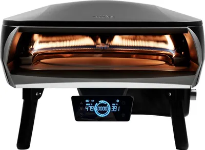 A black and silver pizza oven with its heating elements visible inside.