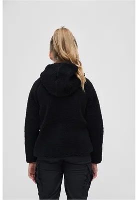 A person wearing a black hooded jacket and black pants, viewed from the back.