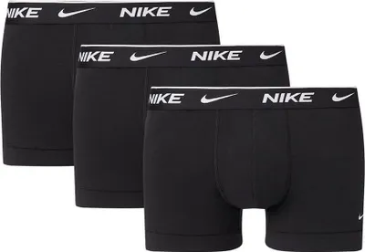 Three black Nike boxer shorts are neatly arranged.