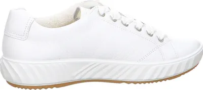 A side view of a white sneaker on a white background.