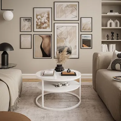 A living room scene with a sofa, coffee table, and wall art.