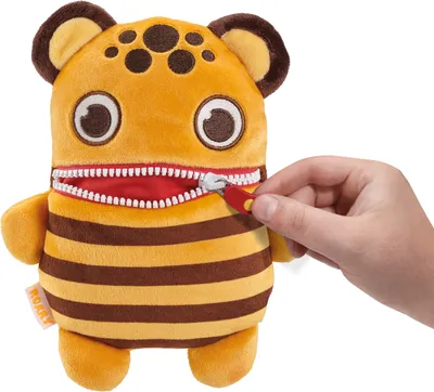 A hand is shown zipping up a plush toy monster with orange and brown stripes.