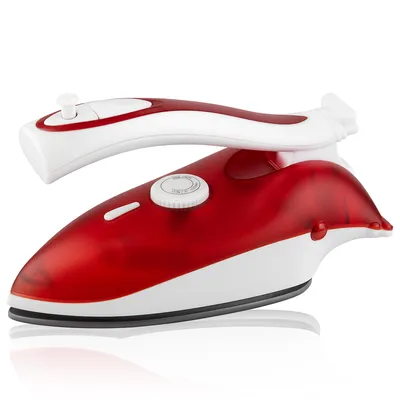 A studio shot of a red and white travel iron against a white background.