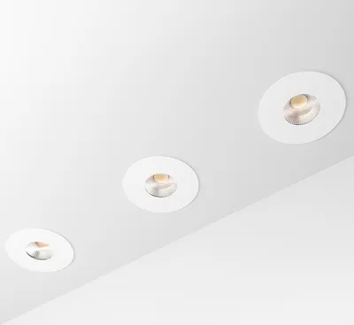 Three recessed ceiling lights are shown on a white ceiling.