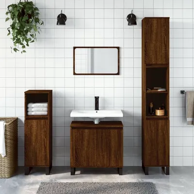 A bathroom vanity set with a sink, mirror, and storage cabinets against a tiled wall.
