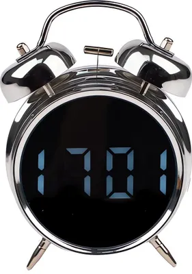 A close-up studio shot of a silver alarm clock with a digital display.