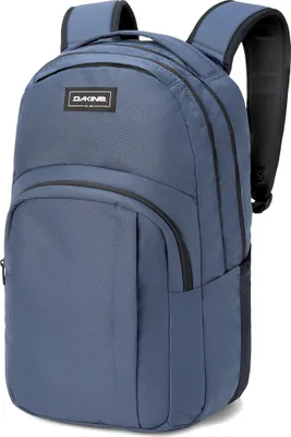 A blue Dakine backpack is shown against a white background.