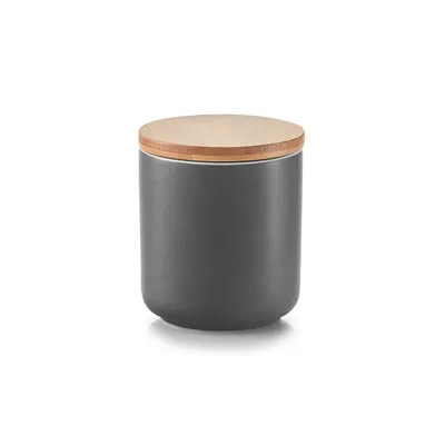 A gray ceramic jar with a bamboo lid is shown against a white background.