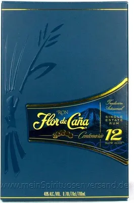 A dark blue box with embossed details and a label for Flor de Cana Centenario 12 Year Old Rum.