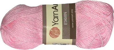A ball of pink yarn on a white background.