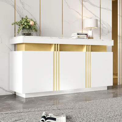 A modern white sideboard with gold accents and a marble-effect top, placed against a marble-patterned wall.