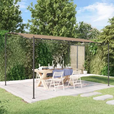 An outdoor dining set under a pergola with a taupe canopy, surrounded by lush greenery.
