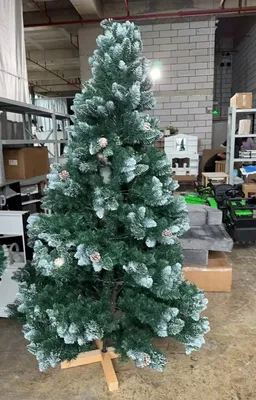 Immagine prodotto di Albero di Natale artificiale - Effetto neve con pigne - Altezza 210 cm - Aghi densi in PVC+PE - Supporto in legno - Blu