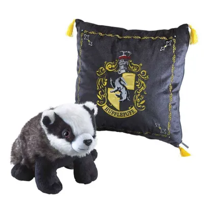 A plush badger toy and a Hufflepuff crest pillow are displayed against a white background.