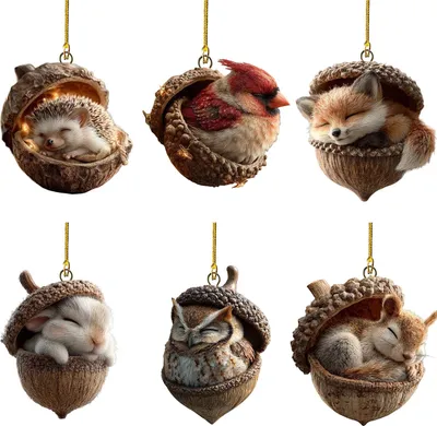 Six different woodland animal ornaments shaped like acorns, each featuring a sleeping animal inside.